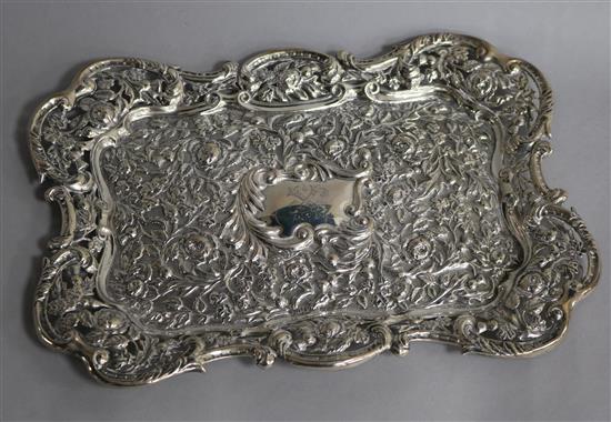 An Edwardian repousse silver dressing table tray by Matthew John Jessop, London, 1902, 9.5 oz.